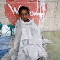 A girl displaced by the fighting in the Red Sea port city of Hodeidah sits at a school where IDPs live in Sanaa in June. 84 dead in fighting in Yemen's Hodeida after U.N.-brokered peace talks fail