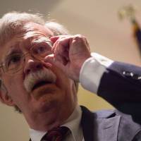 U.S. national security adviser John Bolton speaks to the Federalist Society in Washington Monday. The United States threatened Monday to arrest and sanction judges and other officials of the International Criminal Court if it moves to charge any American who served in Afghanistan with war crimes. Bolton called the Hague-based rights body “unaccountable” and “outright dangerous” to the United States, Israel and other allies, and said any probe of U.S. service members would be “an utterly unfounded, unjustifiable investigation.” U.S. threatens to arrest ICC judges who probe Americans for alleged war crimes in Afghanistan