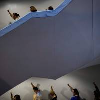 Activists protest against Supreme Court nominee Judge Brett Kavanaugh in the Hart Senate Office Building on Thursday. Supreme Court nominee accuser agrees to testify before U.S. Senate