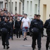 People take part in a mourning march in Koethen, eastern Germany, on Sunday, following the killing of a 22-year-old German man in a fight. German police took two Afghan nationals into custody on suspicion of killing a man in a fight in Koethen, prompting calls for calm as anti-migrants tensions flare. The death comes two weeks after the fatal stabbing of a German man, allegedly by two asylum seekers, in the eastern city of Chemnitz sparked anti-foreigner protests and far-right violence, sending shockwaves through Germany. Fears of 'second Chemnitz' as Afghan pair are held over German man's death