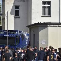 Protesters against a far-right demontration gather at the train station of Koethen, Germany, Sunday. Far-right organizations including the anti-Islam group PEGIDA say they want to protest the death a week ago of a 22-year-old German who died after a dispute with two migrants. German police deploy over 1,000 against far-right march in eastern town of Koethen