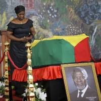 A member of the public pays her respects as the coffin of former U.N. Secretary-General Kofi Annan lies in state at the Accra International Conference Center in Ghana on Tuesday. Ghana's public says farewell to Kofi Annan