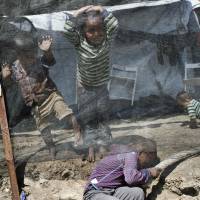 Children play inside the Moria refugee camp on the northeastern Aegean island of Lesbos, Greece, in May. Authorities are to move about 2,000 asylum seekers out of the severely overcrowded migrant camp on Lesbos by the end of September, Greece’s government spokesman said on Tuesday as charities slammed conditions in the facility. Greece to move 2,000 out of overcrowded Lesbos migrant camp amid outcry by charities