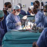 French Dr. Olivier Baron, a thoracic and cardiovascular surgeon from the Nantes University Hospital, assisted by Malian Dr. Baba Ibrahima Diarra, realise the first open-heart surgery in Mali, at the Andre Festoc Center of the Mother and Child Hospital Le Luxembourg in Bamako Monday. A 6-year-old girl with a heart defect was successfully operated on during an open-heart surgery monday in Bamako, a first for Mali, where this type of operation has generally, required an evacuation of the patient abroad. Girl, 6, becomes first in Mali to have open heart surgery