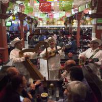 A “jarocho” band plays in the Salon Tenampa restaurant in Garibaldi Plaza in Mexico City on Wednesday. At the Tenampa, which bills itself as having first brought mariachi troupes to the plaza in the 1920s, a manager said it was business as usual Saturday despite a brazen Friday night shooting that killed four people and wounded nine in Garibaldi Plaza. Killings in famed mariachi plaza pose test for Mexico's new government