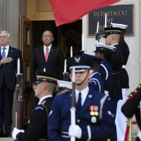 Defense Secretary Jim Mattis (left) and Philippine Secretary of National Defense Delfin Lorenzana stand at attention during a ceremony welcoming Lorenzana to the Pentagon Tuesday in Washington. Defense chief Jim Mattis dismissive of news reports of tension with Trump