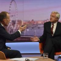 Former British Brexit Secretary David Davis (right) appears on the Andrew Marr Show on BBC television in London on Sunday. May stands firm on her Brexit plan, but skepticism among other lawmakers persists