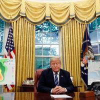 U.S. President Donald Trump holds an Oval Office meeting on hurricane preparations for Hurricane Florence at the White House in Washington Tuesday. Trump to target foreign meddling in U.S. elections with sanctions order: sources