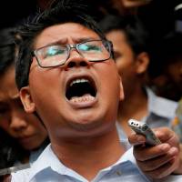 Reuters journalist Wa Lone leaves after listening to the verdict at a court in Yangon on Monday. Reuters reporters who exposed Myanmar military abuses are jailed for seven years
