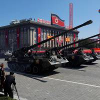 Self-propelled artillery roll past during a military parade marking the 70th anniversary of North Korea’s foundation in Pyongyang on Sunday. Trump nearly sent tweet that could have sparked war with North Korea, Watergate journalist says