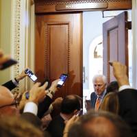 Senate Majority Whip Sen. John Cornyn, R-Texas, responds to reporters’ questions on Supreme Court nominee Brett Kavanaugh Tuesday on Capitol Hill in Washington. Trump feels 'terribly' for top court pick as Democrats seek FBI probe into alleged sexual misconduct