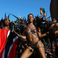 Participants dance in costumes during the West Indian Day parade in the Brooklyn borough of New York Monday. Annual NYC parade showcases Caribbean pride, amid tight security