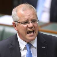 Australian Prime Minister Scott Morrison speaks in the House of Representatives at Parliament House in Canberra on Monday. New Australian Prime Minister Scott Morrison survives first test but discontent grows