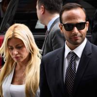 George Papadopoulos and his wife, Simona Mangiante Papadopoulos, arrive at U,S, District Court for his sentencing in Washington on Friday. Ex-Trump campaign adviser George Papadopoulos sentenced to 14 days in prison