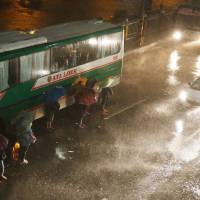 Manila commuters brave the rain and strong winds brought about by Typhoon Mangkhut, which barrelled into the northeastern Philippines before dawn Saturday. Ferocious Typhoon Mangkhut knocks out power as it plows through northeast Philippines