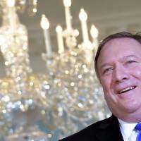 U.S. Secretary of State Mike Pompeo poses for photos at the State Department in Washington on Sept. 13. U.S. Secretary of State Pompeo works to replenish diplomatic ranks, restore morale after cuts under Tillerson