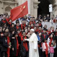 Pope Francis meets a group of faithful from China at the end of his weekly general audience in St. Peter’s Square, at the Vatican on April 18. Pope acknowledges China bishop deal will cause suffering