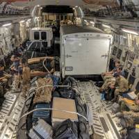 Pararescue personnel from the Alaska Air National Guard’s 212th Rescue Squadron, 176th Wing, and California ANG’s 131st Rescue Squadron, 129th Rescue Wing, settle into a C-17 Globemaster III aircraft in preparation for offering support to Hurricane Florence relief operations, at Moffett Federal Airfield, California, Wednesday. Pentagon: Slow-moving Hurricane Florence to make rescues challenging in flood zones
