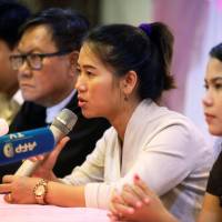 Pan Ei Mon, wife of Reuters journalist Wa Lone, talks to reporters during a family and lawyers press conference in Yangon Tuesday. Wives of Reuters reporters jailed in Myanmar call for their release
