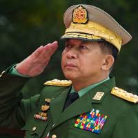 Chief Senior Gen. Min Aung Hlaing, commander in chief of the Myanmar armed forces, salutes during a ceremony in Yangon on July 19. U.N. should not 'interfere' in Rohingya crisis, Myanmar army chief says