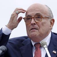 udy Giuliani, an attorney for President Donald Trump, addresses a gathering during a campaign event for Eddie Edwards, who is running for the U.S. Congress, in Portsmouth, New Hampshire, Aug. 1. President Donald Trump will not answer any questions, written or in-person, about possible obstruction of justice, Giuliani told The Associated Press. Giuliani’s statement was the most definitive rejection yet of special counsel Robert Mueller’s efforts to interview the president about any efforts to block the investigation into possible coordination between his campaign and Russians. Rudy Giuliani to AP: Trump will not answer obstruction questions