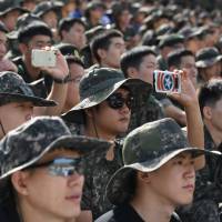 South Korean soldiers watch a live fire demonstration during a media preview of the Defense Expo Korea 2018 at Seungjin Fire Training Field in Pocheon, 65 kms northeast of Seoul, on Tuesday. A branch of the country’s armed forces has said that twelve inventive South Korean college students deliberately made themselves overweight to dodge mandatory military service. South Korea students gain weight 'to dodge military service'