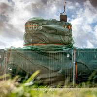 This file photo shows the homemade submarine UC3 Nautilus covered with green tarpaulin in Nordhavn, a harbor area in Copenhagen on April 25. Convicted killer of Kim Wall in Danish submarine murder appeals sentence
