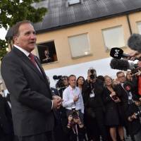 Swedish Prime Minister Stefan Lofven talks to the media at the Social Democratic Party’s election wake in Stockholm on Sunday. Sweden’s Social Democrats are tipped to be the country’s biggest party after Sunday’s election, with the far-right Sweden Democrats trailing in third place, a TV4 exit poll predicted shortly before polling stations closed. Sweden's prime minister invites opposition to talks as far right makes election gains