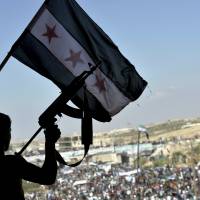 Thousands demonstrate against the Syrian government’s Idlib offensive on Friday in the northwestern town of Maarat al-Numan. Syria criticizes U.N. body investigating war crimes