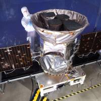 TESS, the Transiting Exoplanet Survey Satellite, is shown in this NASA photo obtained by Reuters in March. NASA's TESS telescope spots two new planets light years away five months after launch