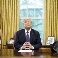 U.S. President Donald Trump listens during a phone conversation with his Mexican counterpart, Enrique Pena Nieto, on trade at the White House in Washington on Aug. 27. Trump sees mixing trade, foreign policy as good politics