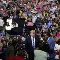 President Donald Trump is interviewed before the start of a rally in Billings, Montana, Thursday. Trump officials cry 'Not me!' as he fumes over incendiary NYT column