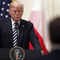 President Donald Trump listens to a reporter’s question during a news conference with Polish President Andrzej Duda in the East Room of the White House Tuesday in Washington. With declassification of interview info, Trump prepares latest jab at Russia probe
