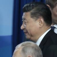 Chinese President Xi Jinping and Russian President Vladimir Putin are seen after their talks on the sidelines of the Eastern Economic Forum in Vladivostok on Tuesday. Russia launches biggest war games in decades