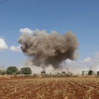Smoke billows following Syrian government forces’ bombardment around the village of al-Muntar on the southern edges of the rebel-held Idlib province on Saturday. Russian airstrikes on Syria’s last major rebel bastion were the “most violent” in a month since Damascus and its ally Moscow started threatening it with an imminent attack around a month ago, a monitor said. Moscow accuses U.S. of using white phosphorous in Syria