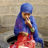 A girl eats boiled leaves from a local vine to stave off starvation, in the extremely impoverished district of Aslam, Hajjah, Yemen, in August. The situation in Aslam district is a sign of the holes in an international aid system that is already overwhelmed but is the only thing standing between Yemen’s people and massive death from starvation amid the country’s 3-year civil war. 5.2 million children at risk of famine in Yemen: charity