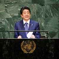 Japanese Prime Minister Shinzo Abe addresses the 73rd session of the United Nations General Assembly at U.N. headquarters in New York Tuesday. Abe tells U.N. Japan will pursue free trade and he hopes to meet North Korea's Kim