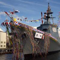 The Defense Ministry plans to equip the Maritime Self-Defense Force’s new Aegis destroyer Maya, seen in this photograph taken in July, with an SM-6 anti-air missile system to shoot down cruise missiles. Defense Ministry to equip Aegis ship with SM-6 missile interceptor system