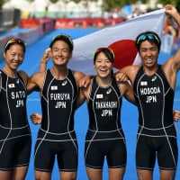 Japanese triathletes (left to right) Yuka Sato, Jumpei Furuya, Yuko Takahashi and Yuichi Hosoda pose after winning gold in the mixed triathlon relay on the final day of the 2018 Asian Games in Palembang, Indonesia, on Sunday. Asian Games analyzed for tips ahead of 2020 Games