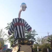 Onyudo, a traditional giant puppet regarded as a symbol of Yokkaichi, Mie Prefecture, is placed on a float at the Grand Yokkaichi Festival in early August. 200-year-old Mie puppet's neck on the line as whaling ban makes crucial part scarce