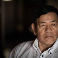 Toshio Sakamoto, who worked as a prison guard for 27 years, poses for a photograph in the Kokubunji area of western Tokyo on Aug. 1. Death row inmates in Japan are executed not by professionals but by ordinary prison staff who may have guarded the condemned for months or even years. Cruel, secretive and politically popular: Japan's death penalty