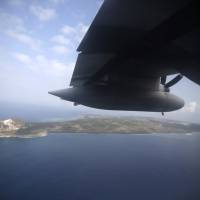 Iwo Jima, now known officially as Ioto, is seen from an airplane in Japan in 2015. The Meteorological Agency said Wednesday that aerial photos detected signs of undersea volcanic eruptions off the southern coast of Iwo Jima, the site of one of the bloodiest campaigns in World War II. Undersea eruption detected at Iwo Jima as seawater is sent shooting into the air