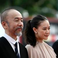 Director and actor Shinya Tsukamoto (left) and stars Yu Aoi and Sosuke Ikematsu arrive for the premiere of the film “Zan” (“Killing”) at the Venice Film Festival on Friday. Pacifist samurai film by Japanese director is a 'scream' against modern-day violence