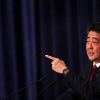 Prime Minister Shinzo Abe speaks during a debate with former Defense Minister Shigeru Ishiba at the Japan National Press Club in Tokyo Friday ahead of the Liberal Democratic Party’s presidential election on Thursday. Abe Cabinet climbs to 41.7% in latest opinion poll