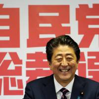 Prime Minister Shinzo Abe gives a news conference after winning the Liberal Democratic Party’s leadership vote at the party’s headquarters in Tokyo on Thursday. Abe likely to retain key ministers in Cabinet reshuffle, official says