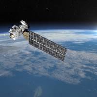 This illustration shows a satellite flying in space over the Earth. A Japanese team working to develop a “space elevator” will conduct a first trial this month, blasting off a miniature version on satellites to test the technology. Next floor please: Japan team to test mini 'space elevator' in world first