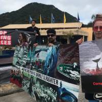Activists attend a protest during the International Whaling Commission (IWC) conference in Florianopolis, Brazil, on Monday. Nations lock horns in Brazil over Japan's call to resume whaling