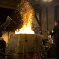 Fired up: Participants get hands-on experience in traditional steelmaking at Kindai Tatara workshop in Unnan City. Stoke the flames of tradition on Shimane’s ‘Iron Road’