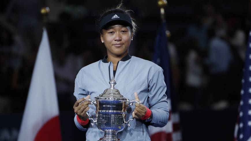 Power of diversity: Naomi Osaka holds her trophy after defeating Serena Williams in the women’s final of the U.S. Open tennis tournament on Sept. 8 in New York. Warning to Naomi Osaka: Playing for Japan can seriously shorten your career