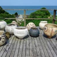 A collection of tsubo (clay jars) on the balcony of Kazunori Hamana’s home overlooking the sea in Isumi, Chiba Prefecture. Kazunori Hamana: Simple vessels of complex self-reflection